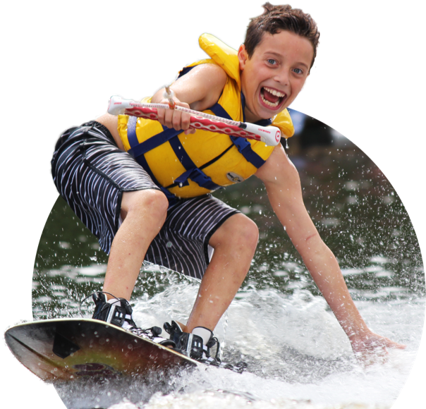 Excited boy waterskiing