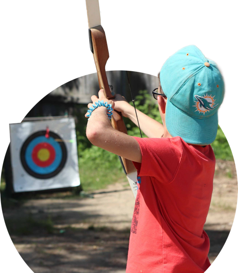 Child shooting an arrow at a target
