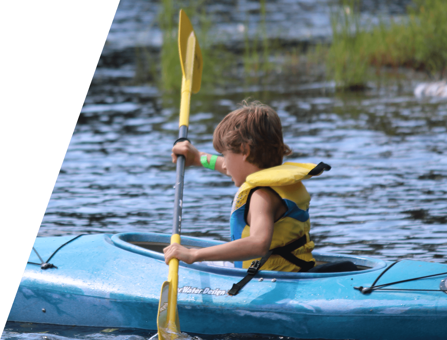 Child canoeing on the lake