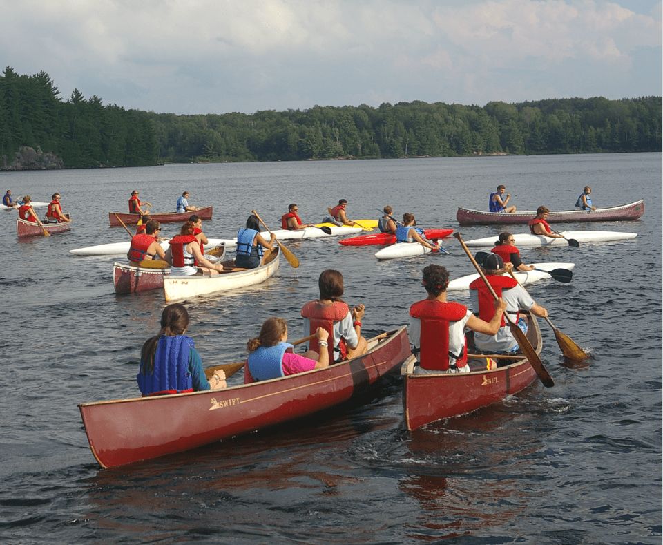 Campers canoeing on lake at Camp Tamarack