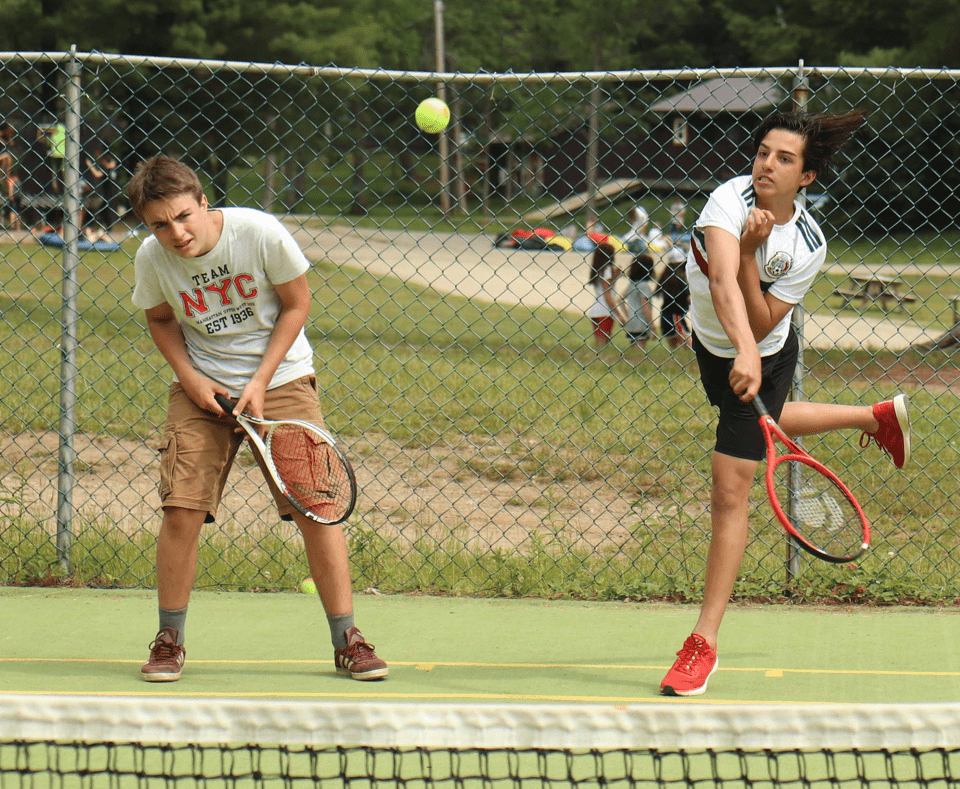 Campers playing tennis at Camp Tamarack