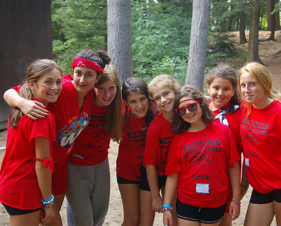 Group of young campers outside cabin at Camp Tamarack