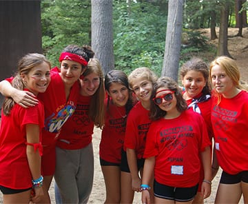 Group of young campers outside cabin at Camp Tamarack